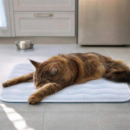 Maine Coon stretched out on the large CozyCat Mat on a tile kitchen floor
